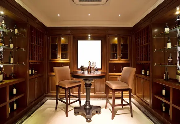 custom cabinetry for a modern wine shop with dark brown wood and a matching table