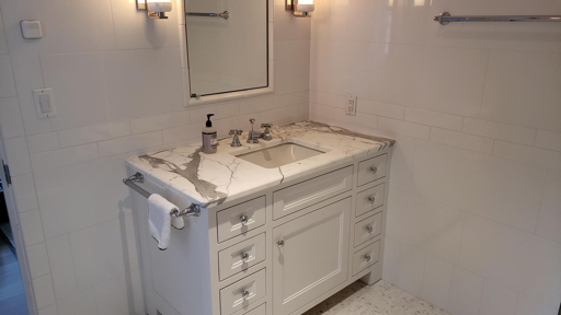 a white marble bathroom sink