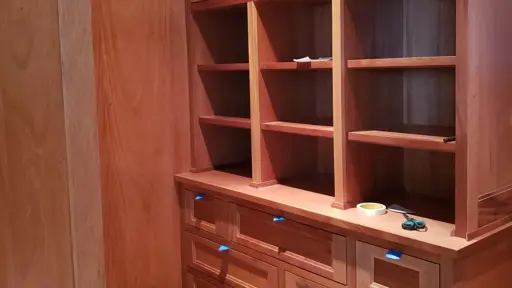 a wooden bookcase cabinet