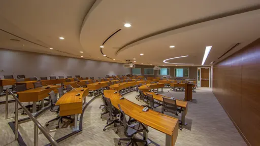 a conference room with tables and chairs