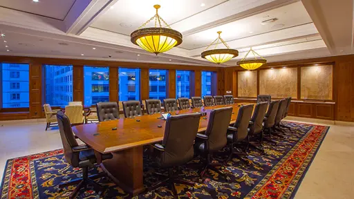 a conference room with a large table and chairs